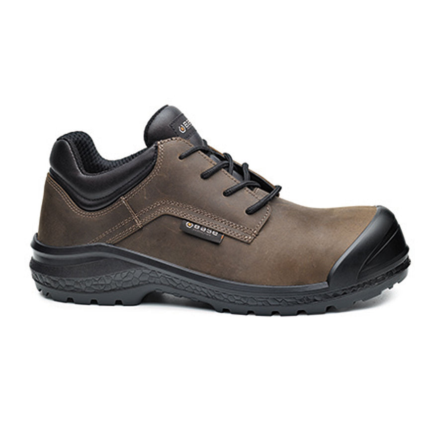 Brown Base Be Jetty/ Be Browny Safety Shoe. Shoe has a black sole, Black sole upper, black scuff cap and black laces. Shoe has base branding.