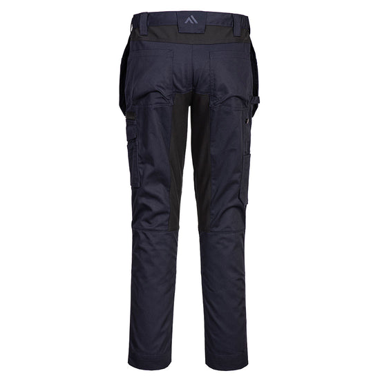Back of Portwest WX2 Eco Stretch Holster Trousers in dark navy with belt loops on waist band, Flap holster pockets on waist band, pockets on top and sides and black panels on insides of legs, below waist band and side of knees.