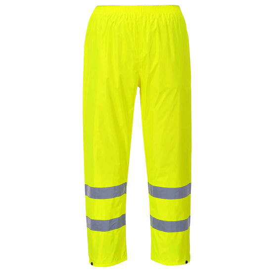 Yellow hi vis rain trousers with hi vis ankle bands on the ankles.