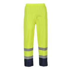 Yellow Hi-Vis classic contrast rain Trouser with reflective strips on the ankles and navy contrast on the bottom of the legs.
