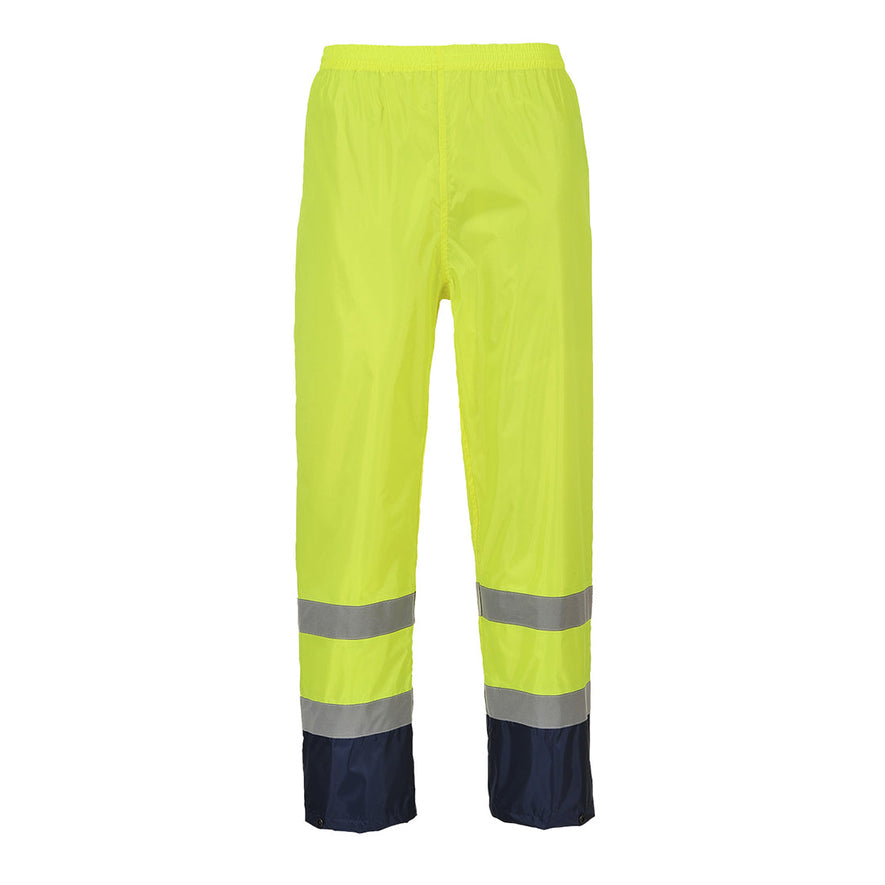 Yellow Hi-Vis classic contrast rain Trouser with reflective strips on the ankles and navy contrast on the bottom of the legs.