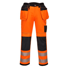 PW3 Hi-Vis Stretch Holster trousers in Orange with black contrast on the belt and pocket area as well as the kneepad pocket area. Trousers have pockets, belt loops, knee pad pockets and holster style pockets. Trousers have hi vis bands on the ankles.