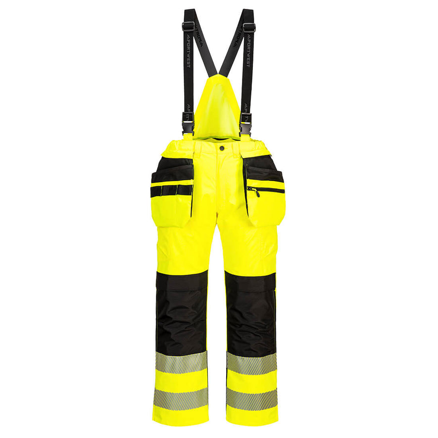 Portwest PW3 Hi-Vis Rain Trousers in yellow with black panels on knees, pockets and straps over shoulders. Reflective strips on ankles and pockets on hips attached to waist band.
