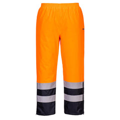 Portwest Hi-Vis Winter Trousers in orange with elasticated waist and navy panel on lower leg as well as two reflective strips. 