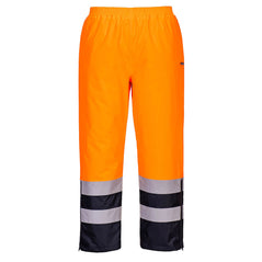 Portwest Hi-Vis Winter Trousers in orange with elasticated waist and navy panel on lower leg as well as two reflective strips.