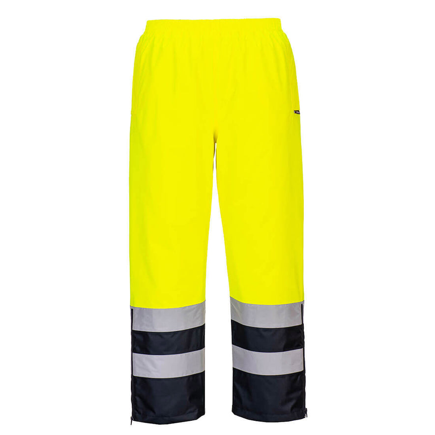 Portwest Hi-Vis Winter Trousers in yellow with elasticated waist and navy panel on lower leg as well as two reflective strips. 