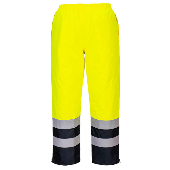 Back of Portwest Hi-Vis Winter Trousers in yellow with elasticated waist and navy panel on lower leg as well as two reflective strips. 