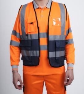 Orange Hi vis executive vest with two tone accents of navy at the bottom of the vest. Two waist bands and shoulder bands. Zip fasten, Front pockets, D loop and Id badge holder.