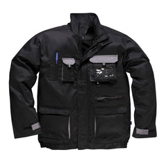 Black portwest Texo Contrast Jacket. Jacket has pockets on the front waist, Chest and midrift of the jacket. One phone pocket and one pen pocket with an ID badge holder on the left. Grey contrast on the flaps and sides of the pockets.