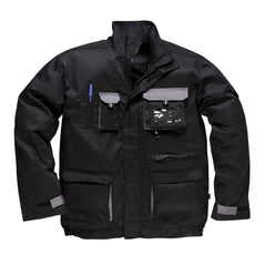 Black portwest Texo Contrast Jacket. Jacket has pockets on the front waist, Chest and midrift of the jacket. One phone pocket and one pen pocket with an ID badge holder on the left. Grey contrast on the flaps and sides of the pockets.
