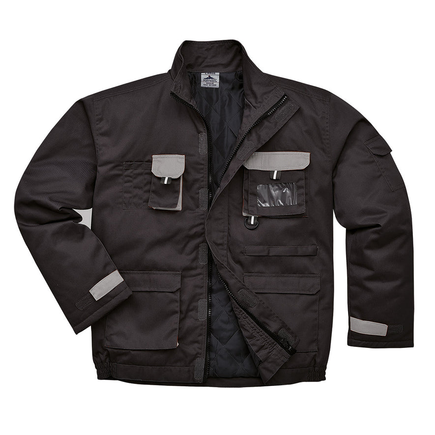 Black portwest Texo lined Contrast Jacket. Jacket has pockets on the front waist, Chest and midrift of the jacket. One phone pocket and one pen pocket with an ID badge holder on the left. Grey contrast on the flaps and sides of the pockets.