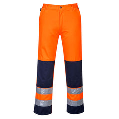 Orange portwest Seville hi vis trousers. Trousers have kneepad pockets. side pockets and hi vis bands. Bands are on the ankles and there is orange contrast on the knee pads and ankle area.