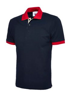 Uneek Clothing UC107 - 250GSM Contrast Poloshirt in navy with short sleeves, collar and three button plackett. Collar and hem of sleeves are in red and inside of plackett is white.