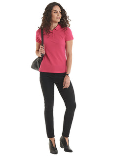 Person wearing Uneek Clothing UC115 180GSM Ladies Polo Shirt with short sleeves, collar and three button plackett in hot pink.