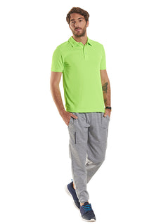 Person wearing Uneek Clothing UC125 Mens Ultra Cool Poloshirt in electric green with short sleeves, collar and three button plackett.