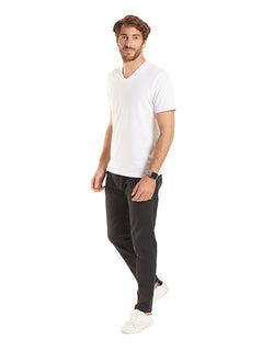 Person wearing Uneek Clothing UC317 - 180 GSM Mens Classic V Neck T-shirt short sleeve in white.