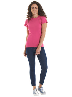Person wearing Uneek Clothing UC318 - Ladies Classic Crew Neck T-Shirt short sleeve in hot pink.