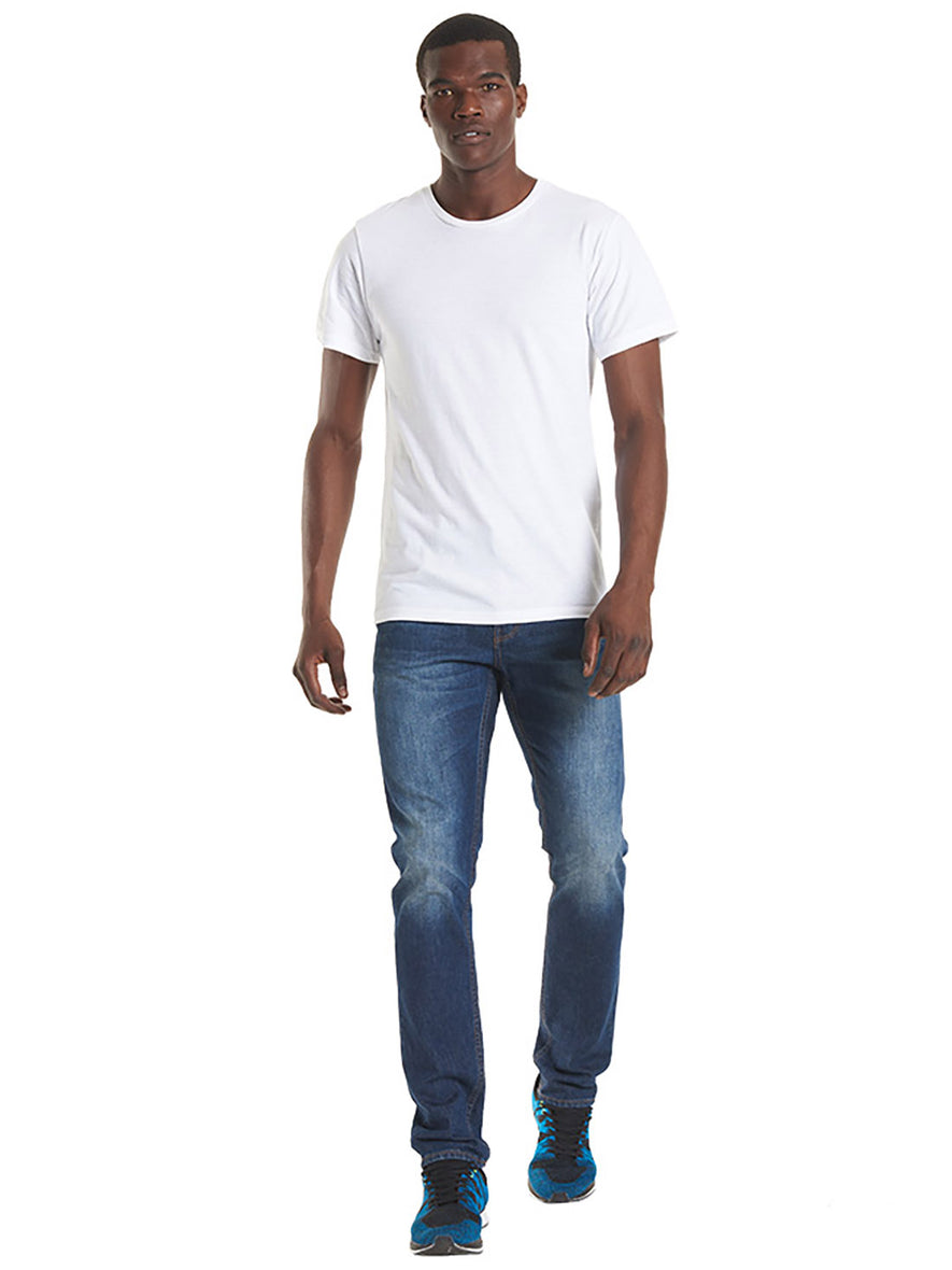 Person wearing Uneek Clothing UC320 - 150 GSM Olympic T-shirt short sleeve in white.