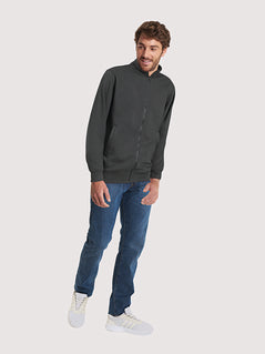 Person wearing Uneek Clothing UC512 Deluxe Unisex Sweat Jacket long sleeve in black with full zip fastening, collar and elasticated bottom and wrists.