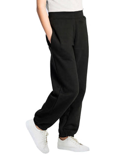 Person wearing Uneek Clothing UC521 Childrens Jog Bottoms in black with pockets and elasticated waist.