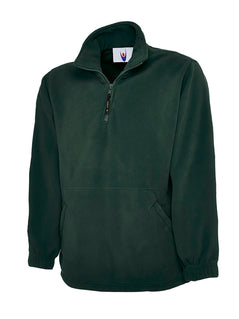 Uneek Clothing UC602 380GSM Premium 1/4 Zip Micro Fleece Jacket in bottle green with part zip fastening and and two zipped lower front pockets.