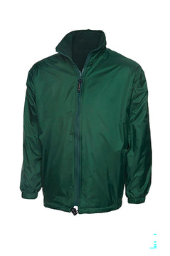 Uneek Clothing UC605 Premium Reversible Fleece Jacket in bottle green with full zip fastening and and two lower front pockets.