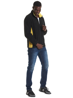 Person wearing Uneek Clothing UC617 280GSM Two Tone Full Zip Fleece Jacket in black with full zip and yellow panels on sides and inside of collar.