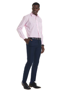 Person wearing Uneek Clothing UC709 - Mens Poplin Full Long Sleeve Shirt in pink with collar, pocket on left chest and pink buttons down front.