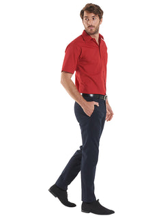 Person wearing Uneek Clothing UC710 Mens Poplin Half Short Sleeve Shirt in burgundy with collar, pocket on left chest and burgundy buttons down front.