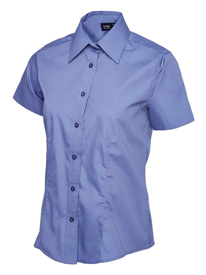 Uneek Clothing UC712 - Ladies Poplin Short Sleeve Shirt in mid blue with tailoring on front, collar and mid blue buttons down front.