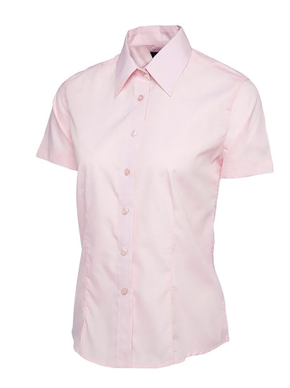 Uneek Clothing UC712 - Ladies Poplin Short Sleeve Shirt in pink with tailoring on front, collar and pink buttons down front.
