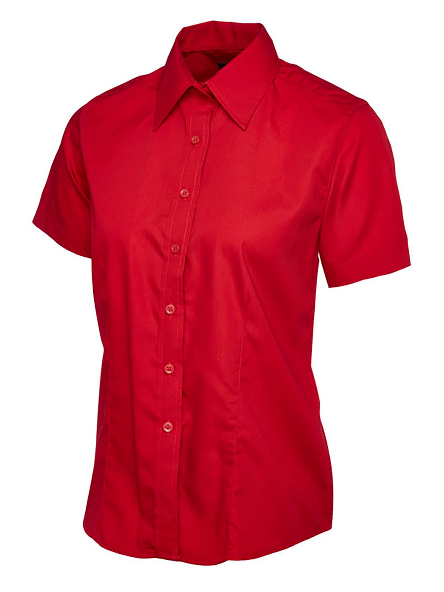 Uneek Clothing UC712 - Ladies Poplin Short Sleeve Shirt in red with tailoring on front, collar and red buttons down front.