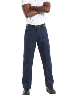 Person wearing Uneek Clothing UC901 Workwear Trouser in navy with sewn in crease down front of leg, belt loops, button and zip fastening at waist and two side pockets.