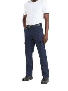 Person wearing Uneek Clothing UC904 Cargo Trouser Knee Pads in navy with belt loops, button and zip fastening at waist, two side pockets and two pockets on side of legs with flaps. Knee pad patches on both knees.