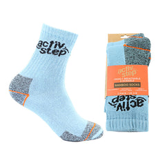 Light blue with grey branding and patches on heel and toe with orange stripes. Two pack of socks in orange retail packaging to the right.