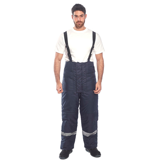 Person wearing Cold store trousers in navy with shoulder braces and hi vis ankle bands.